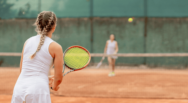 Two tennis players playing 