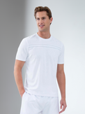 Man wearing inphorm's performance short sleeve crew neck shirt in white front 3/4 view