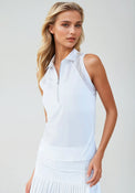 Woman wearing Neisha Classic Sleeveless Polo in white with silver zip and mesh shoulder inserts, demonstrating the semi-fitted design and ventilation features of this moisture-wicking golf shirt | Front view.