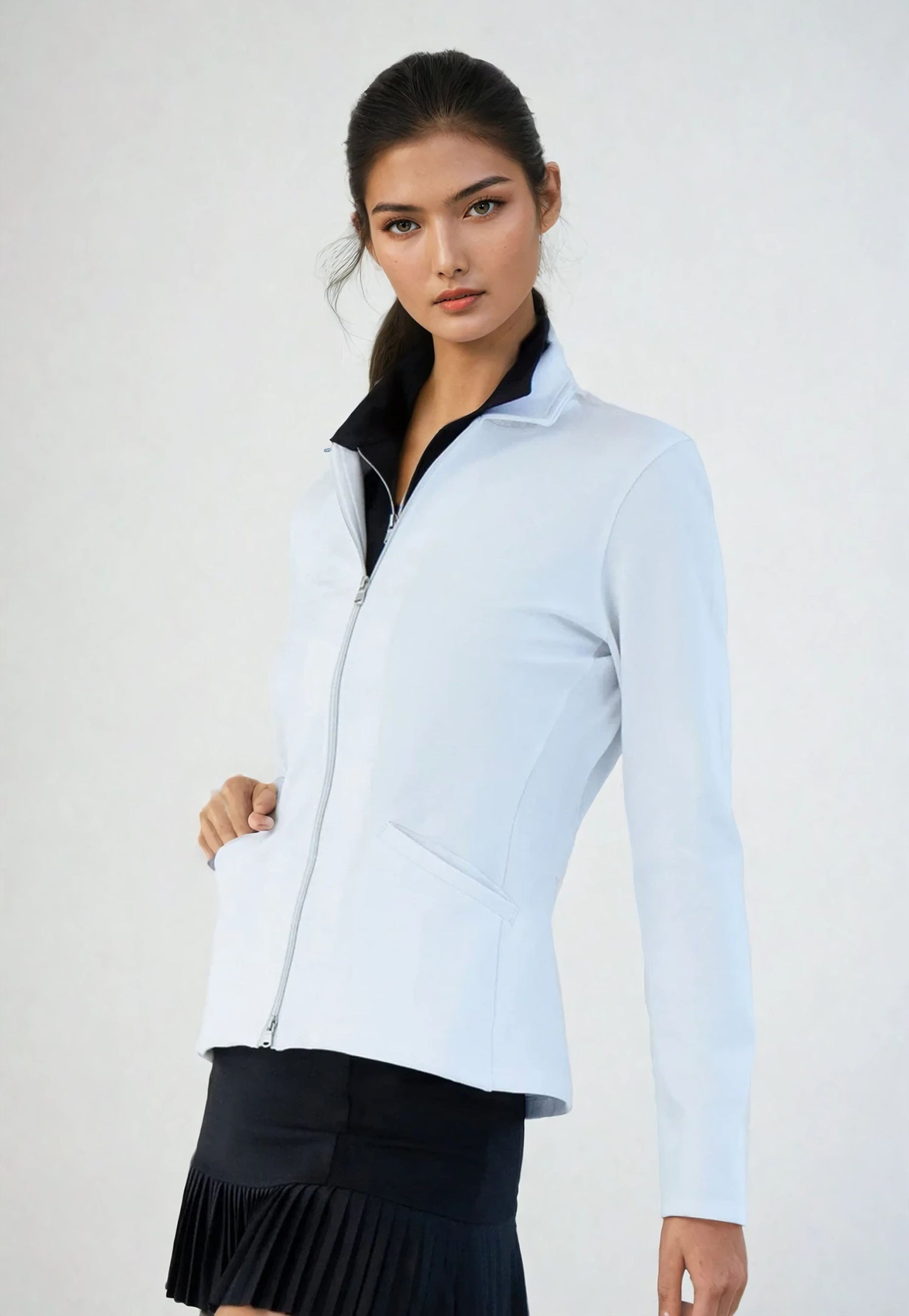 Woman wearing classic-fit Women's Active Blazer in white, showcasing the tailored silhouette with four-way stretch fabric suitable for both professional and active settings.  Left side view.