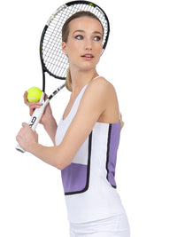 Side view of model wearing the baseline tank in white/lavender combo  by inPhorm NYC with one hand holding her tennis racket and the other holding a tennis ball