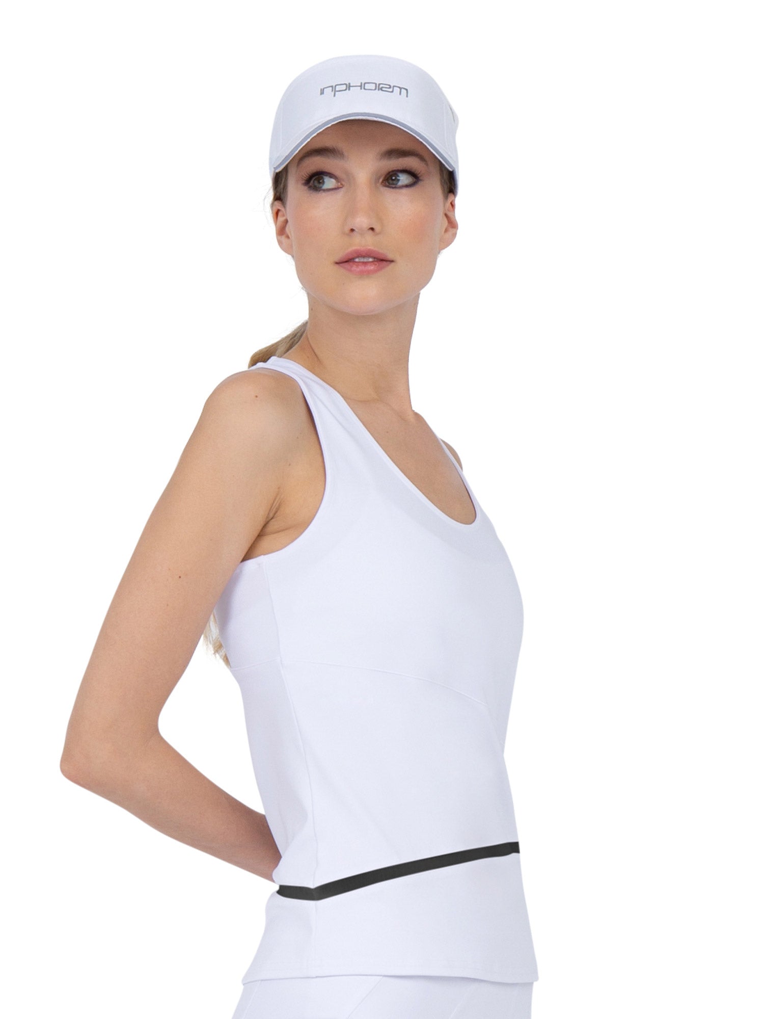 Side view of model wearing the baseline tank in white and black by inPhorm NYC