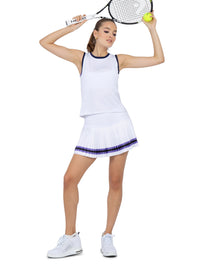 Front view of model wearing the Harper performance tank in white/lavender combo by inPhorm NYC holding a tennis racket in the air