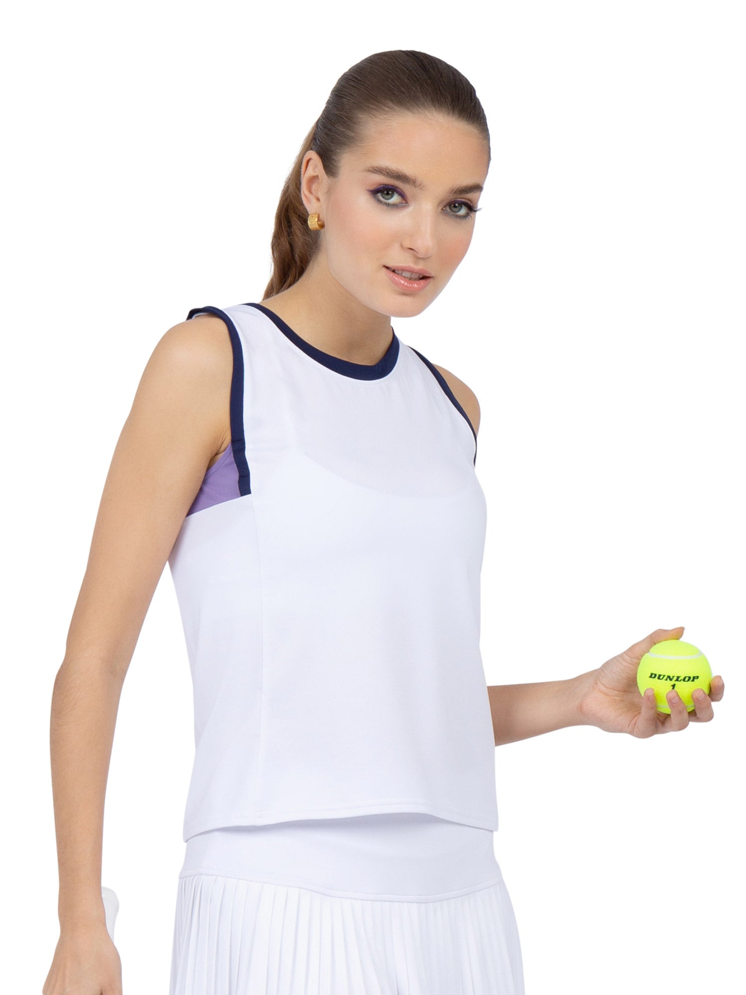 Front view of model wearing the Harper performance tank in white/lavender combo by inPhorm NYC holding a tennis ball