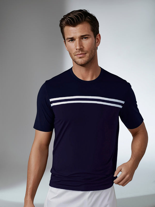 Man wearing inphorm performance short sleeve crew neck in midnight with white stripes front view.