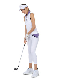 Side view of model wearing the Harper performance sleeveless white/lavender combo by inPhorm NYC pretending to putt