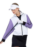 Front view of model wearing the Sofia knit jacket in white/lavender combo by inPhorm NYC wearing a white visor and white golf glove