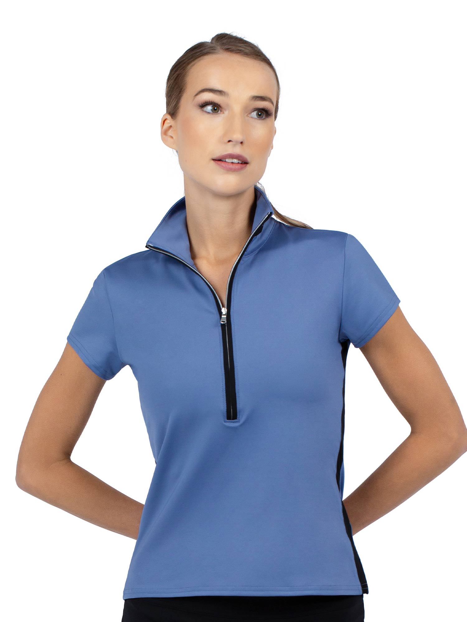 Front view of model wearing the Amelia short sleeve quarter zip top palladian/black by inPhorm NYC holding a golf club with her hands behind her back