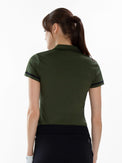 Back view of model wearing the fairway v-neck collar top in militaire/black by inPhorm NYC