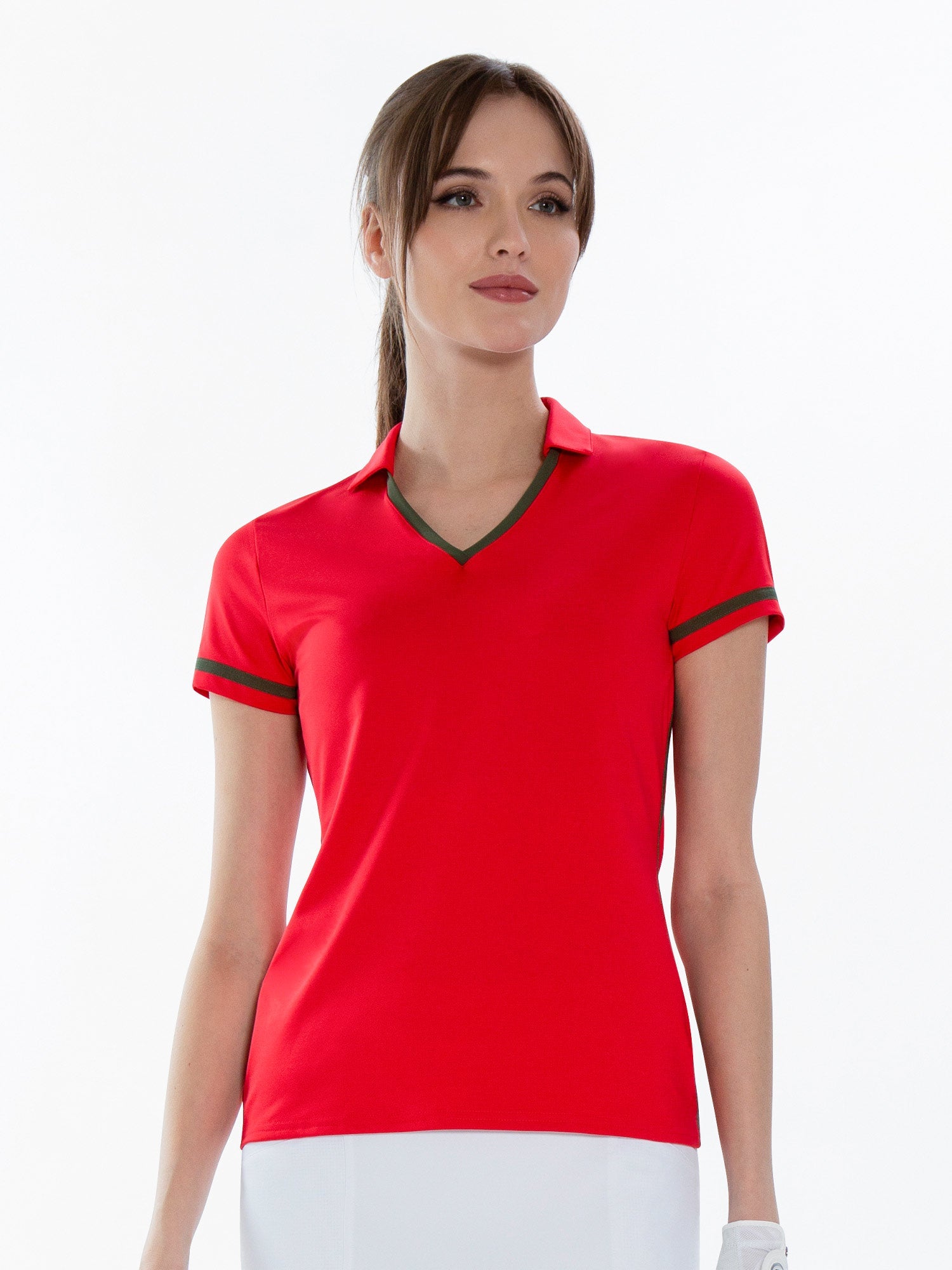 Front view of model wearing the Fairway v-neck collar top in poppy and militaire by inPhorm NYC with her hands at her side