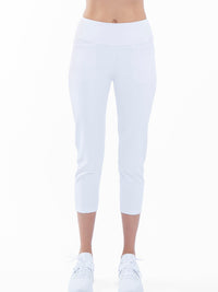 Front view of model wearing the quick dry golf 24" capri pants in white by inPhorm NYC