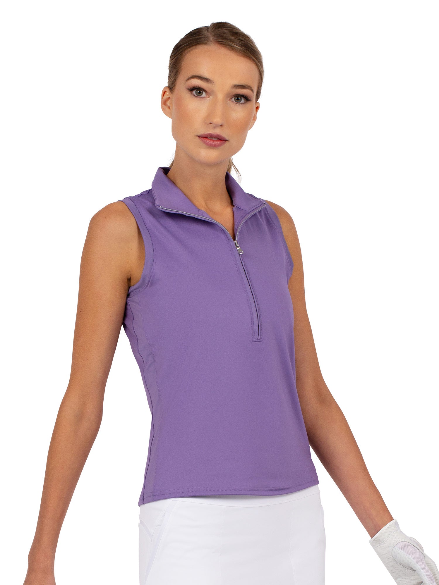 Front view of model wearing the Rhapsody quarter zip sleeveless top in lavender by inPhorm NYC with one hand in her pocket wearing a white glove