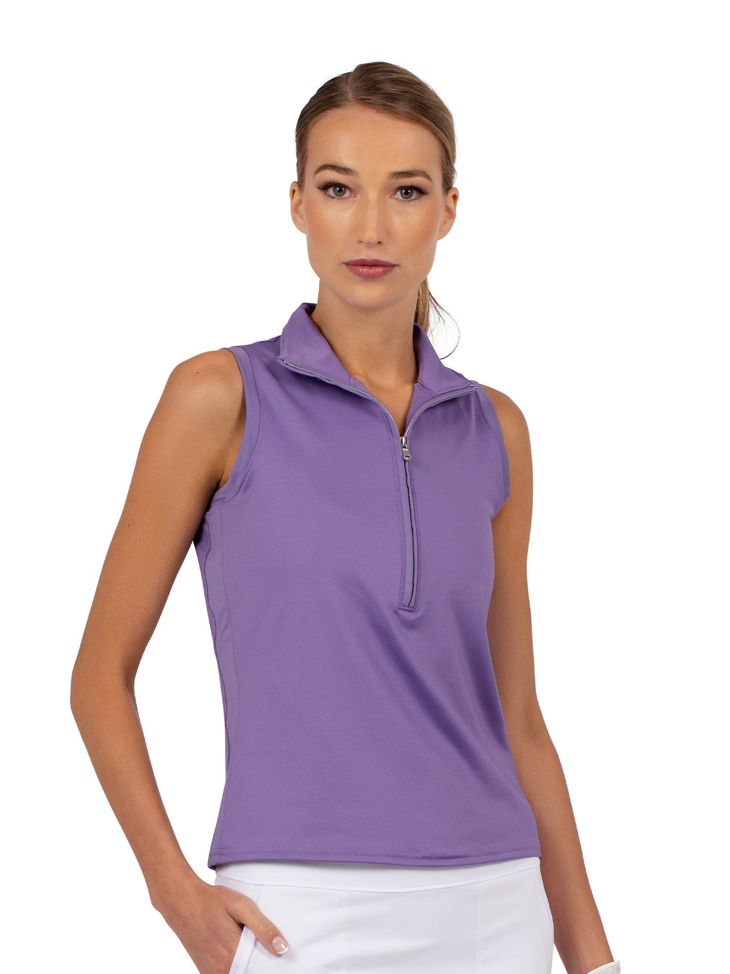 Front view of model wearing the Rhapsody quarter zip sleeveless top in lavender by inPhorm NYC with one hand in her pocket