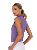 Side view of model wearing the Rhapsody quarter zip sleeveless top in lavender by inPhorm NYC with her hands in her pockets