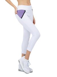 Side view of model wearing the Camilla athleisure capri in white/lavender combo by inPhorm NYC with her hand on her hip