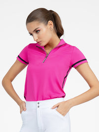 Front view of model wearing the zone short sleeve quarter zip top in pink by inPhorm NYC with her hands in her pockets