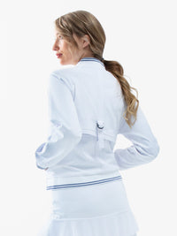 Back view of model wearing the Aubrey lifestyle jacket in white and granite by inPhorm NYC with her hands in her pockets