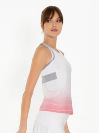 Side view of model wearing the Bailey criss cross back tank in plumeria ombre by inPhorm NYC with her hands at her side