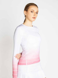 Front view of model wearing the Bailey long sleeve crew neck in plumeria ombre by inPhorm NYC with one hand behind her back