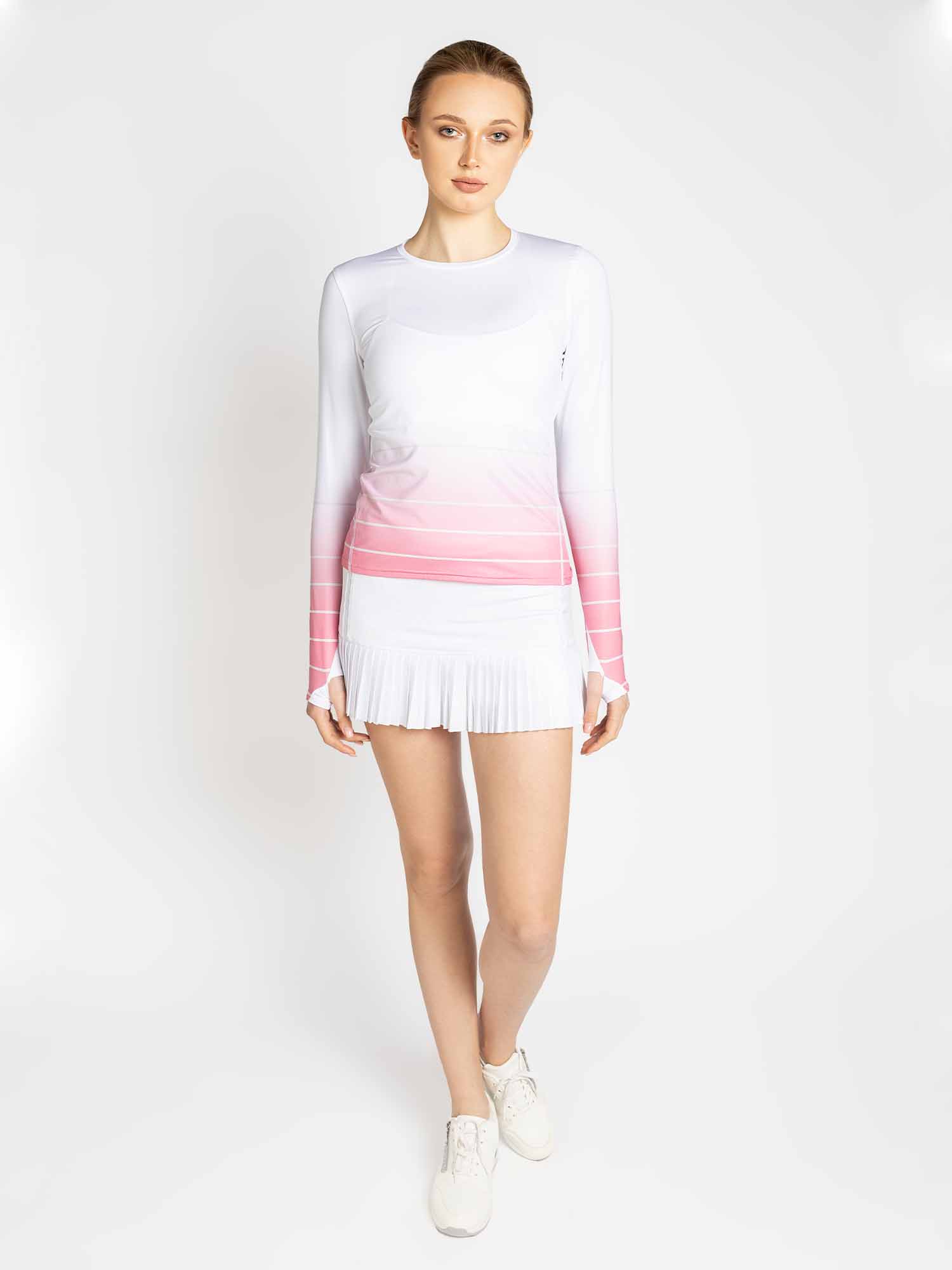 Front view of model wearing the Bailey long sleeve crew neck in plumeria ombre by inPhorm NYC with hands at her side