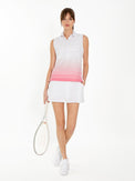 Front view of model wearing the Bailey sleeveless collar top in plumeria ombre by inPhorm NYC holding a tennis racket