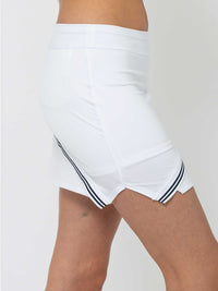 Side view of model wearing the Chloe 15" asymmetrical skirt in white and midnight by inPhorm NYC