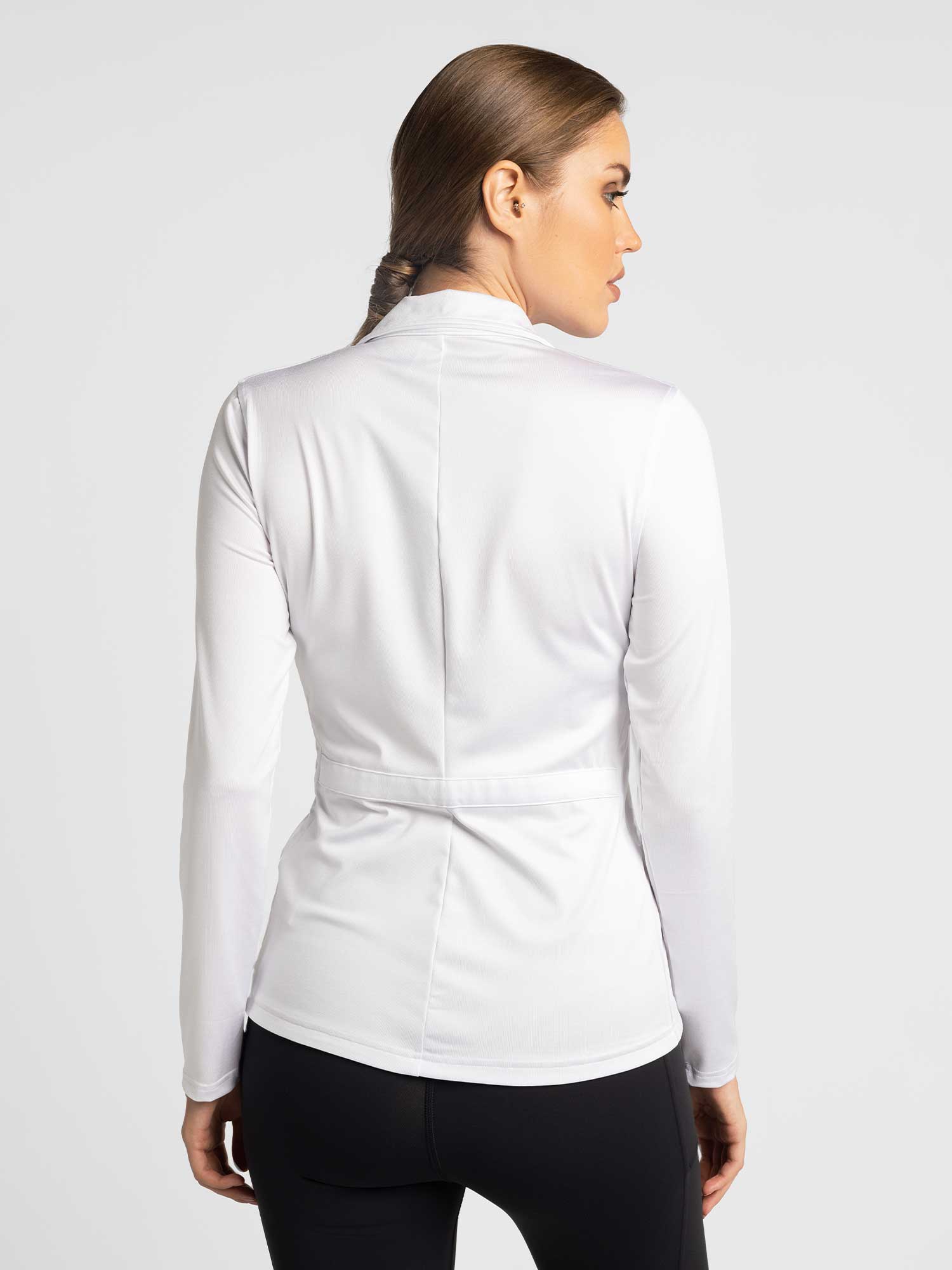 Back view of model wearing the classic Blythe jacket in white by inPhorm NYC with her hands at her side