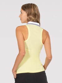 Back view of model wearing the Lilian polo tank in zest by inPhorm NYC with her hands at her side