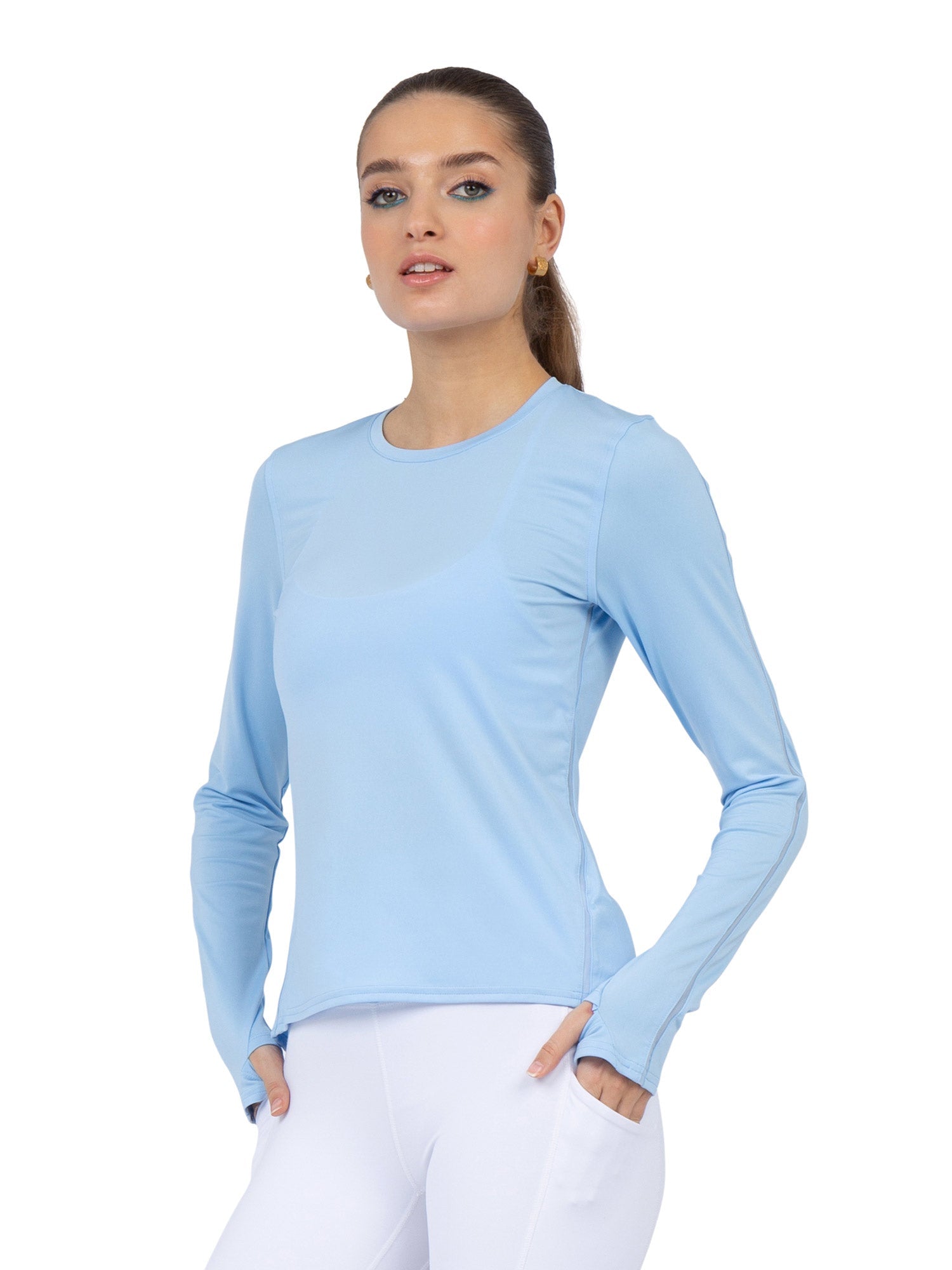 Front view of model wearing the Classic long sleeve crew neck in bluebell by inPhorm NYC with her hand in her pocket