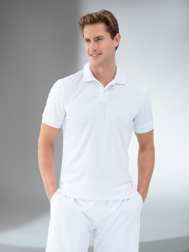 Man wearing inphorm classic rib collar polo in white front view.