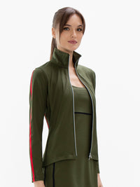 Front view of model wearing the motion knit jacket in militaire and poppy by inPhorm NYC with her hands at her side