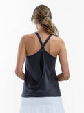 Back view of model wearing the Nora halter neck active and tennis tank in smoke by inPhorm NYC with her arns bent