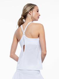 Back view of model wearing the Nora halter neck active and tennis tank in white by inPhorm NYC with her hands at her side