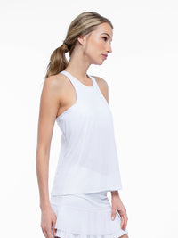 Side view of model wearing the Nora halter neck active and tennis tank in white by inPhorm NYC with her hands at her side