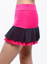 Side view of model wearing the Nora tennis pleated flounce skirt in fucshia and black by inPhorm NYC