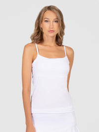 Front view of model wearing the Pearl adjustable strap tank in white by inPhorm NYC with her arms at her side