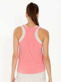 Back view of model wearing the Phoebe tennis and active tank in plumeria combo by inPhorm NYC with her arms at her side