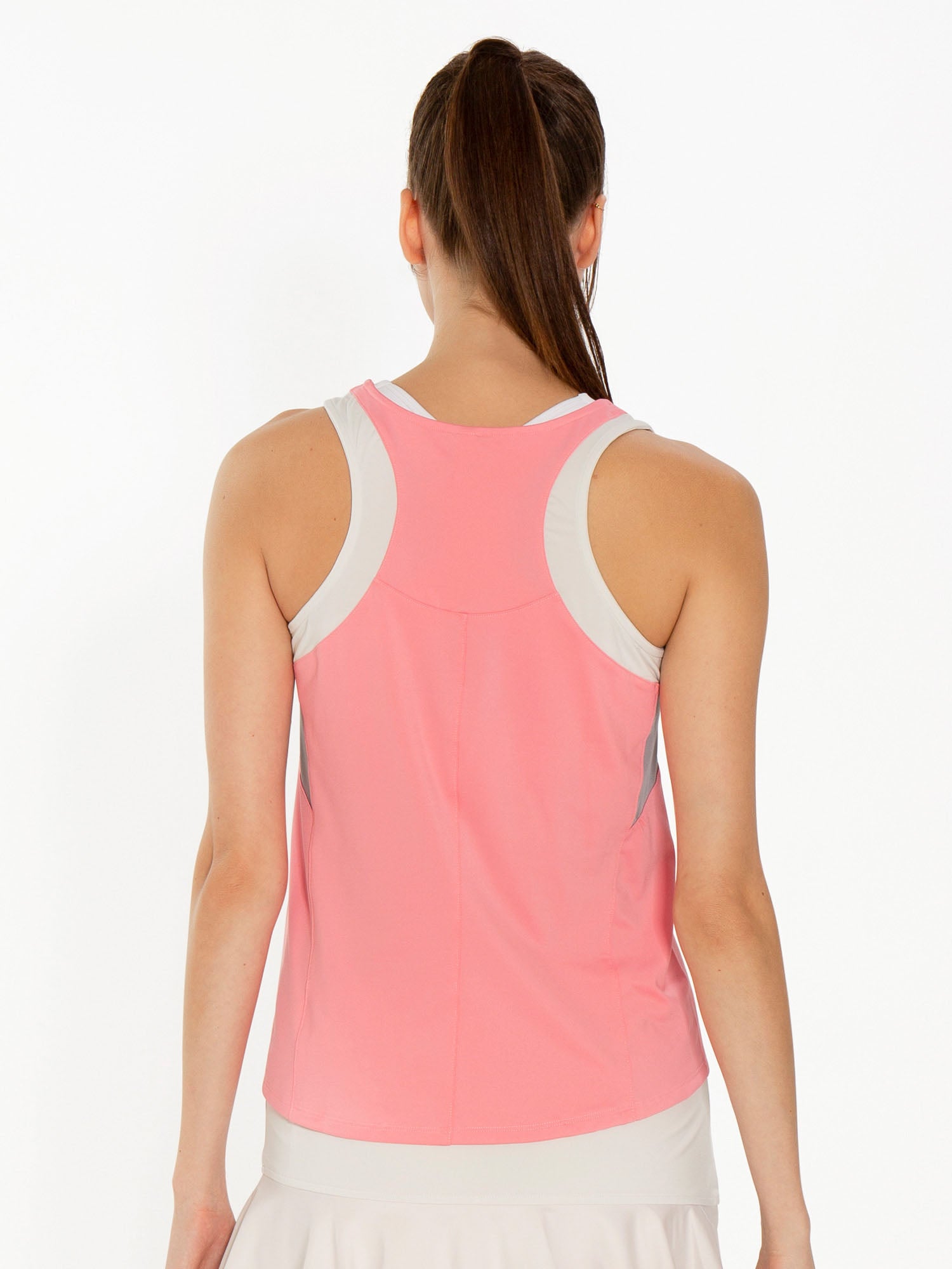 Back view of model wearing the Phoebe tennis and active tank in plumeria combo by inPhorm NYC with her arms at her side