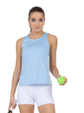 Front view of model wearing the Blaire tank in bluebell and pearl by inPhorm NYC holding a tennis racket and a yellow tennis ball