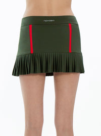 Back view of model wearing the classic 13 1/2" pleated skirt in militare and poppy by inPhorm NYC