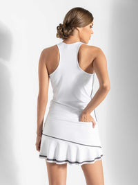 Back view of model wearing the Riley active tank in white and onyx by inPhorm NYC with her hand in her back pocket