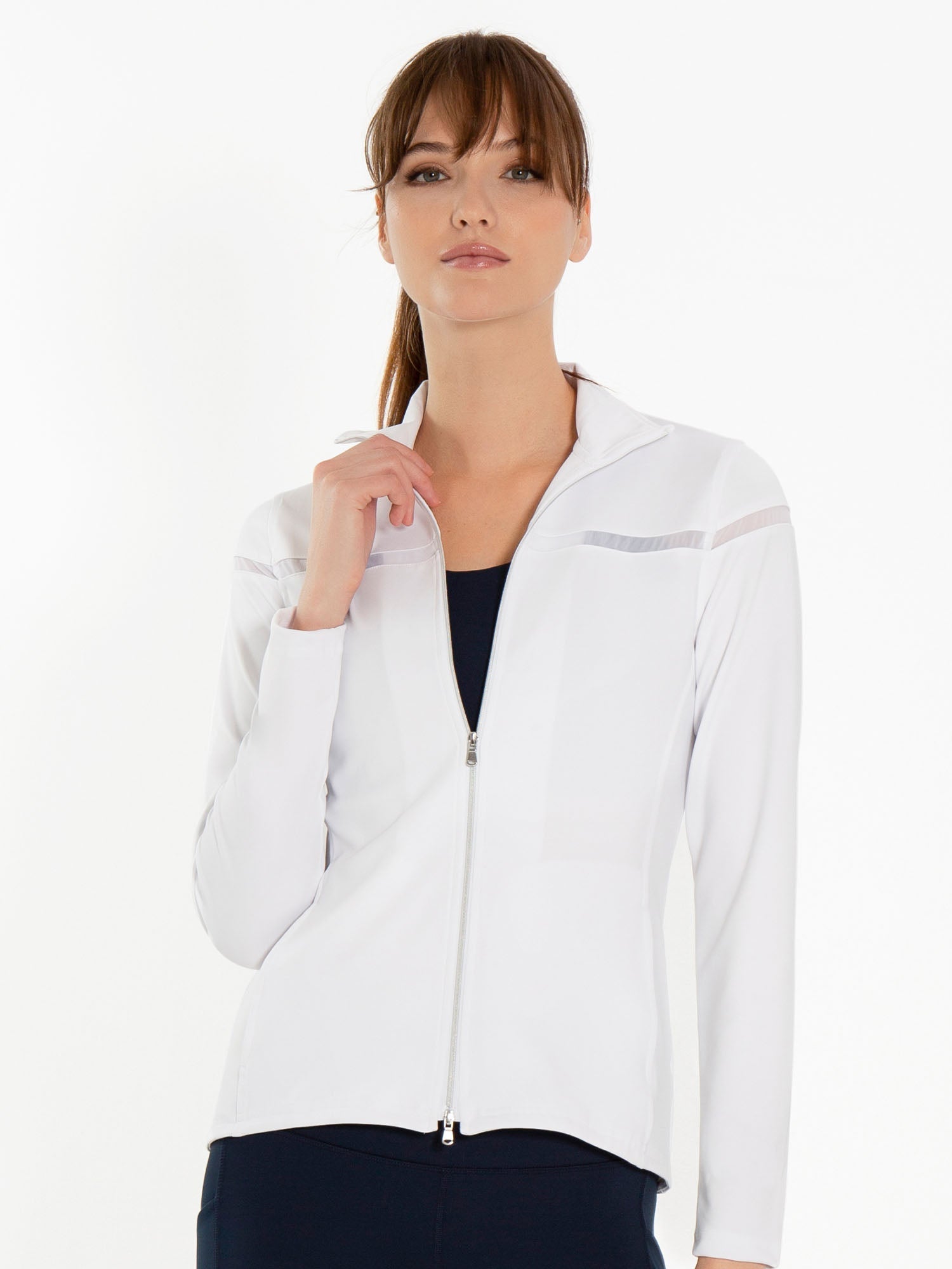 Front view of model wearing the Riley jacket in white by inPhorm NYC with one hand at her side