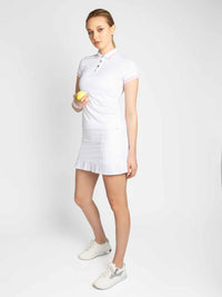 Front view of model wearing the Riley performance short sleeve polo in white and plumeria by inPhorm NYC hloding a yellow tennis ball