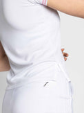 Close up side view of model wearing the Riley performance short sleeve polo in white and plumeria by inPhorm NYC