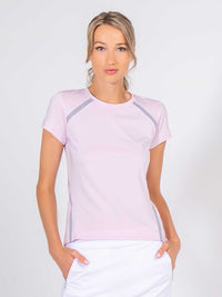 Front view of model wearing the classic short sleeve crew neck in ice pink by inPhorm NYC with her hands in her pockets