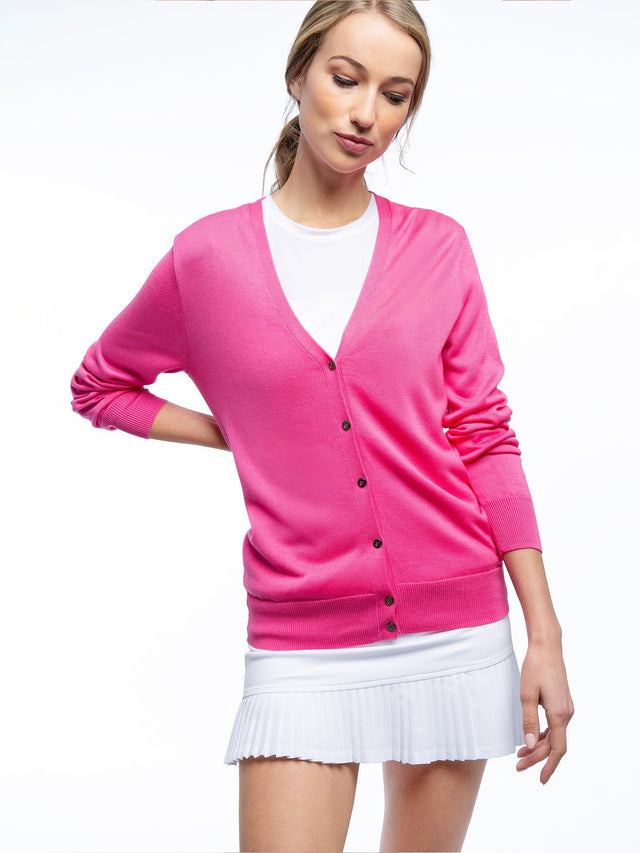 Front view of model wearing the classic cardigan v-neck sweater in pink rose by inPhorm NYC with one hand at her side