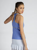 Side view of model wearing the Ashley racer tank in periwinkle/pearl by inPhorm NYC with one hand touching her braid