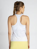 Back view of model wearing the Ashley racer tank in white by inPhorm NYC with her hands at her side