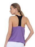 Back view of model wearing the double layer "T" racer back Camilla tank in lavender and black by inPhorm NYC with her hand on her hip