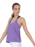 Front view of model wearing the double layer "T" racer back Camilla tank in lavender and black by inPhorm NYC with her arms extended out